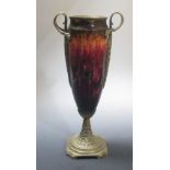 A late 19th century Continental enamelled and brass mounted vase