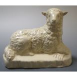 An early 19th century creamware figure of a recumbent sheep