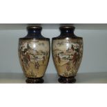 A pair of early 20th century Satsuma vases bearing Shimazu family mon and Satsuma marks, 26cm (10.25