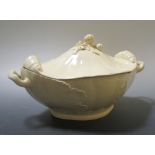 An early 19th century creamware quatrefoil tureen and cover, on an associated stand, 29cm long