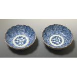 A pair of early 19th century Japanese Arita blue and white bowls, Fuki Choshun marks, 14.5cm (5.75