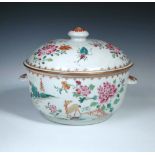 An 18th century Chinese famille rose tureen and cover, 23cm (9 in) diameter  The rim of the cover