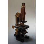 A mahogany cased Watson 'Bactil' monocular microscope, numbered 10519, one objective and three