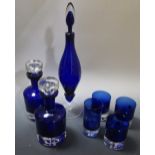 Two Polish blue glass decanter by Krosno and anther tall bottle and stopper together with a quantity