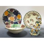 Two middle eastern plates, a bowl, 18.5cm diameter and a Talavera pottery figure, 16cm tall