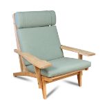 Hans Wegner for Getama, a model GE-375 lounge chair, the oak frame with paddle shaped arms and green