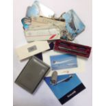 A collection of Concorde memorabilia, comprising a leather cased set of playing cards, a fountain