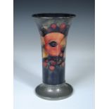 A Moorcroft pomegranate pattern trumpet vase with Tudric pewter foot, together with a Moorcroft