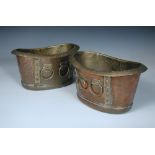 Wood & Co. for Liberty & Co., a pair of oval copper and brass mounted planters or wine coolers,