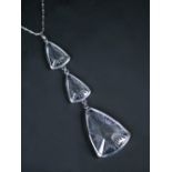 A modern Lalique glass pendant necklace, the silvered metal chain with three blue tinted