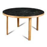 After Alvar Aalto, a model 91 circular dining table, originally designed in 1923, the black laminate