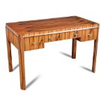 An Art Deco Macassar ebony writing desk, the rectangular top with rounded corners above central
