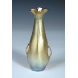 A small Tiffany Favrile glass vase, the iridescent gold tapering body with scalloped rim and two