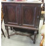 A 19th century mahogany cabinet on stand, 124cm high x 102cm wide