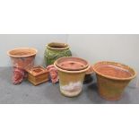 A collection of terracotta plant pots and a pair of similar wall brackets