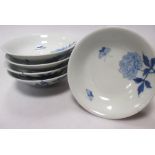 Five Japanese blue and white bowl covers, 11cm diameter and two dishes, 19cm wide