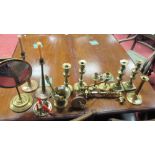 Three pairs of brass candlesticks, two brass wall lights etc