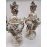Pair of Dresden porcelain floral encrusted vases and covers