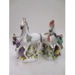 A pair of continental porcelain figures of a rearing horse (af)