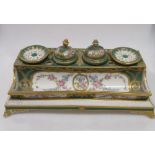 A Continental porcelain ink stand, green glazed with floral painted and gilt decoration, possibly