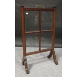 An Edwardian mahogany glazed fire screen and a folding cake stand (2)