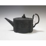 A Turner black basalt tea pot and cover together with a jug moulded with Bacchic putti attributed to