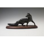 A leather desk stand retailed by Harrods, a bronze fox and a servants call box