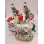 A pair of Staffordshire parrots, a Dalmation, a milkmaid and a seated figure on a barrel (5)