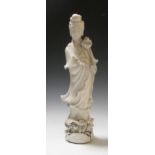 A Guangdong figure of Budai and a blanc de Chine Guanyin