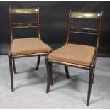 Three Regency brass and inlaid dining chairs and a pair of Victorian carved walnut parlour chairs (