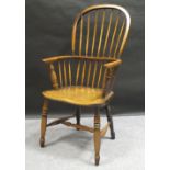 A 19th century Windsor chair in ash and elm, 105 cm high, from the collection of the late