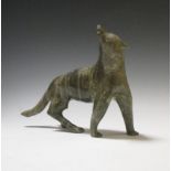 An Inuit hardstone carving of a wolf, 21cm high