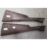 A walnut gun stock and another, possibly for lamp bases (2)