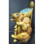 Attributed to Joseph Holdcroft, a majolica bear jug with spoon handle, 26.5cm high  the top of the