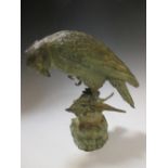 A 20th century green patinated bronze model bird group, 24cm high