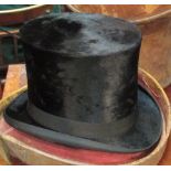 A silk top hat by James Muir, in leather case