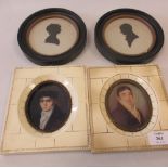 A pair of silhouettes of a Gentleman and Lady in profile, in circular frames; together with a pair