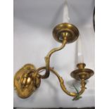 A pair of gilt brass, two branch wall lights