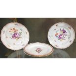 A pair of outside decorated Meissen floral plates and a pair of 'Sevres' plates, possibly by