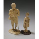 A Japanese ivory man with a staff and another of a lady (2)