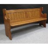 A Victorian pine pew, 180 cm long. From the collection of the late Christopher Hogwood CBE