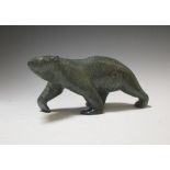 An Inuit hardstone carving of a polar bear, 24cm long