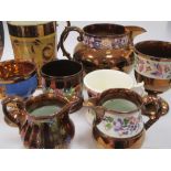 A collection of Staffordshire lustreware, including jugs and mugs