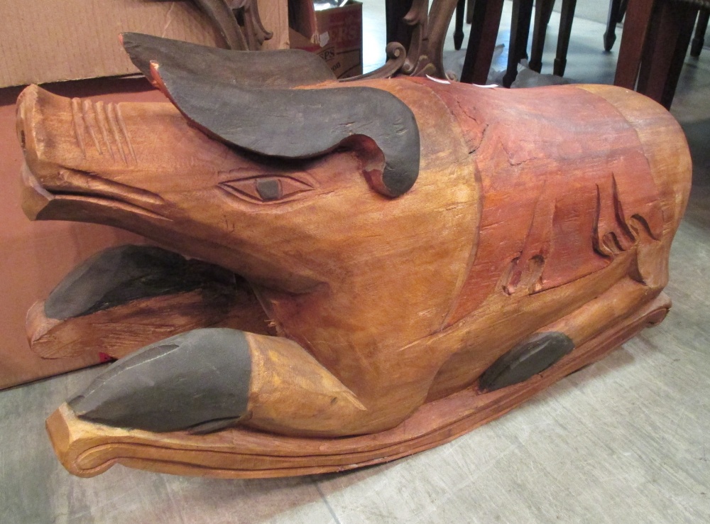 A carved wood rocking pig and painted pig dumb waiter. From the collection of the late Christopher