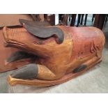 A carved wood rocking pig and painted pig dumb waiter. From the collection of the late Christopher