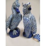 A pair of tin glazed earthenware figures of duck and parrot