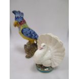 A figure of a plump breasted turkey, possibly Minton, and a majolica parrot (2)