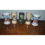 Two pairs of spill vases and another by Wedgwood decorated with flowers on a basalt ground, the
