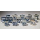 Fourteen early 19th century blue and white decorated coffee cans, including pearlware examples,