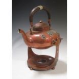 A Gorham copper kettle and stand applied with white metal Oriental sprigs, to include cranes, pine